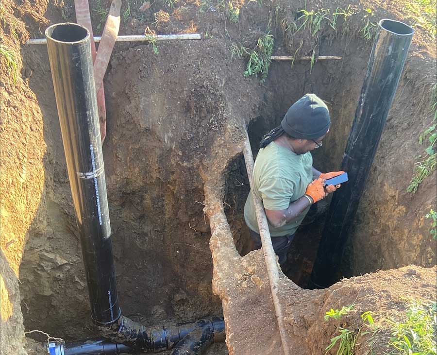 Underground plumbing pipes being repaired in a deep trench in Vacaville, CA