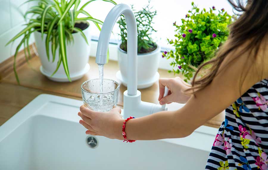 Kitchen tap water being checked for water quality in a Vacaville, CA home