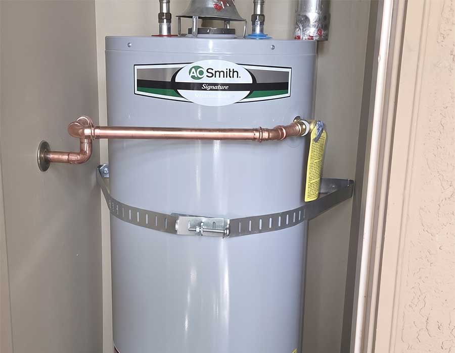 Professionally installed commercial water heater connected to new copper pipes in Vacaville, CA