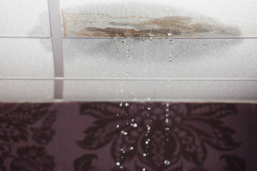 Water leaking through a ceiling from a plumbing emergency in Vacaville