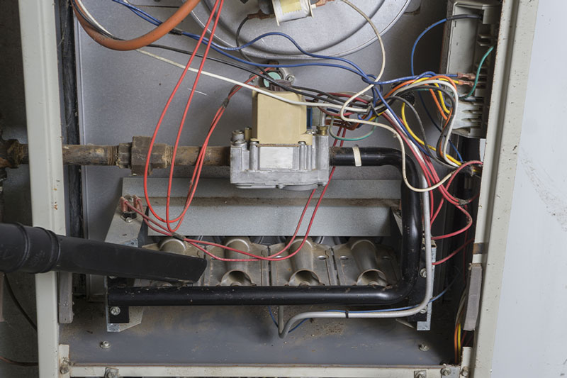 Internal furnace components being serviced during a repair in Vacaville