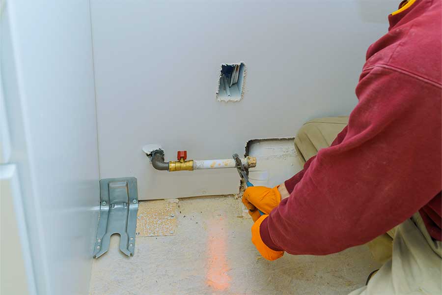 Technician repairing a residential gas line in Vacaville, CA
