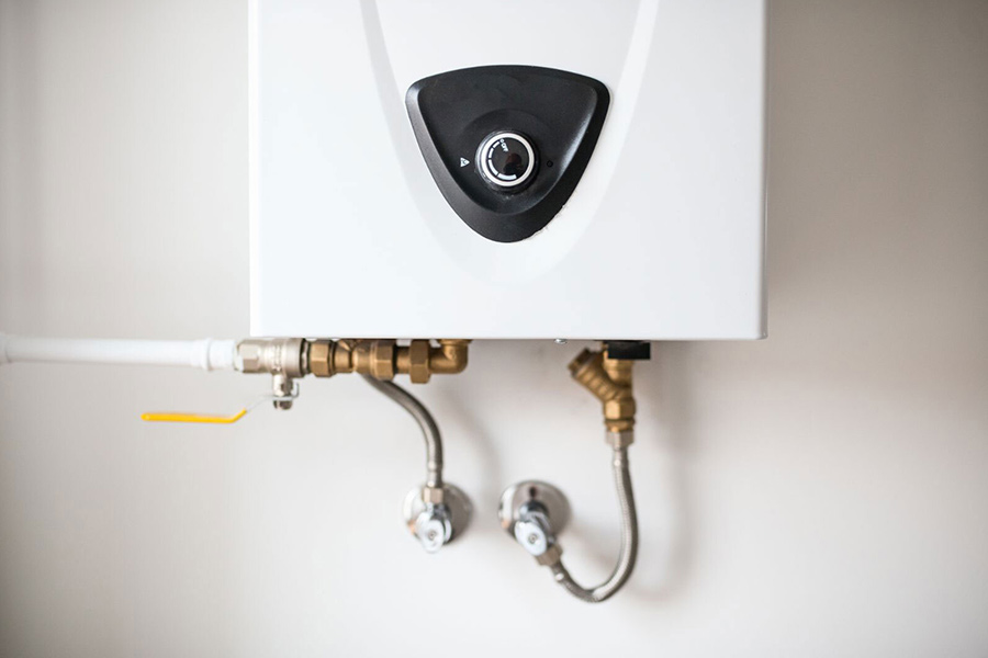 Wall-mounted tankless water heater for commercial repair service